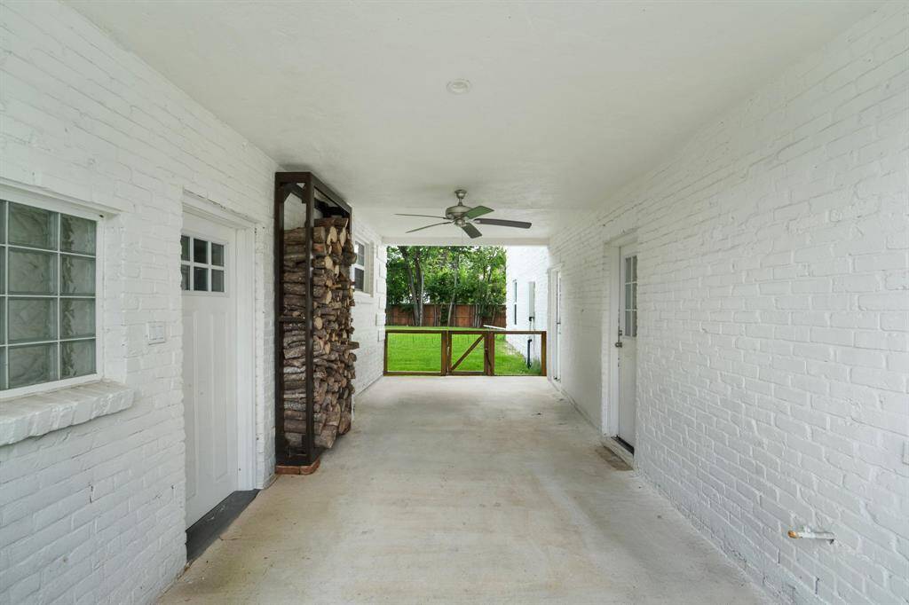 Enjoy convenient access with the covered walkway connecting the garage to the home, providing shelter and ease in every season.