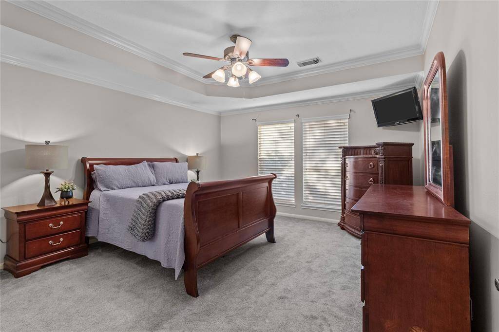 The spacious primary bedroom offers a serene retreat, featuring beautiful neutral tones that create a calm, relaxing atmosphere—your perfect place to unwind.