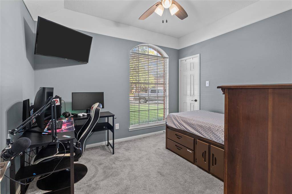 Bedroom 2 offers a comfortable layout with neutral tones and plenty of space—perfect for family, guests, or a home office.