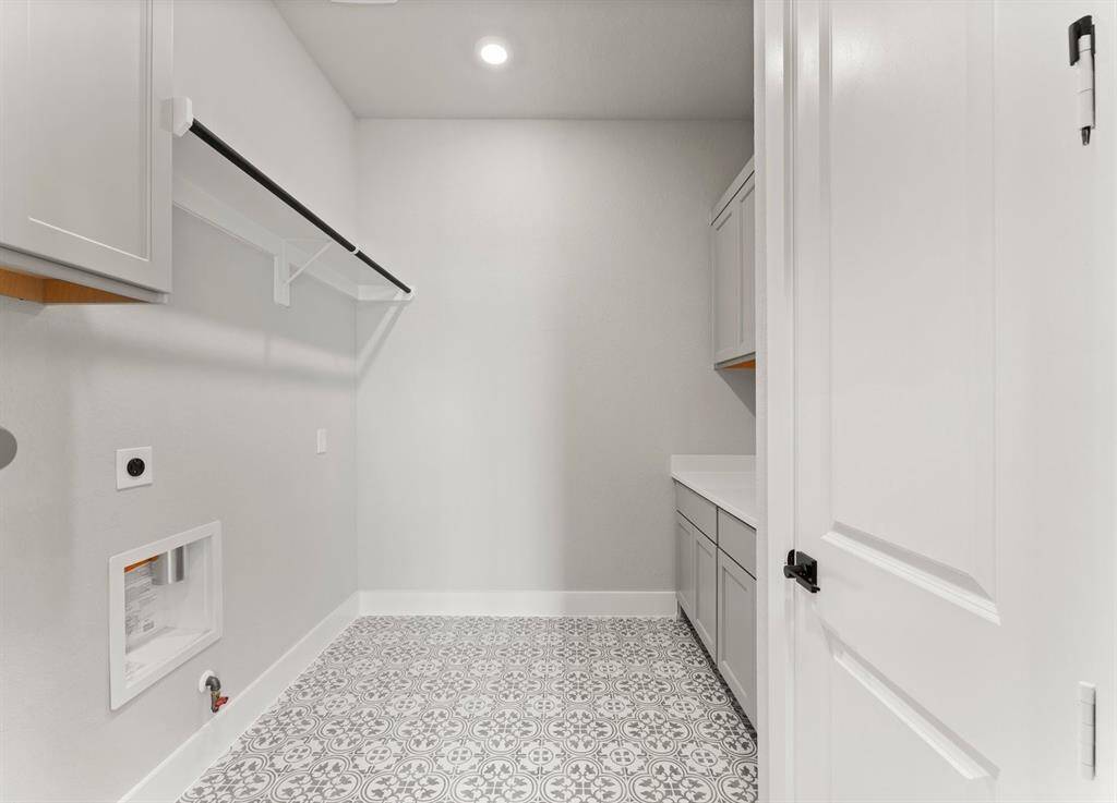 Utility Room with Washer and Dryer Connections, Drying Bar, Folding Area, and Storage