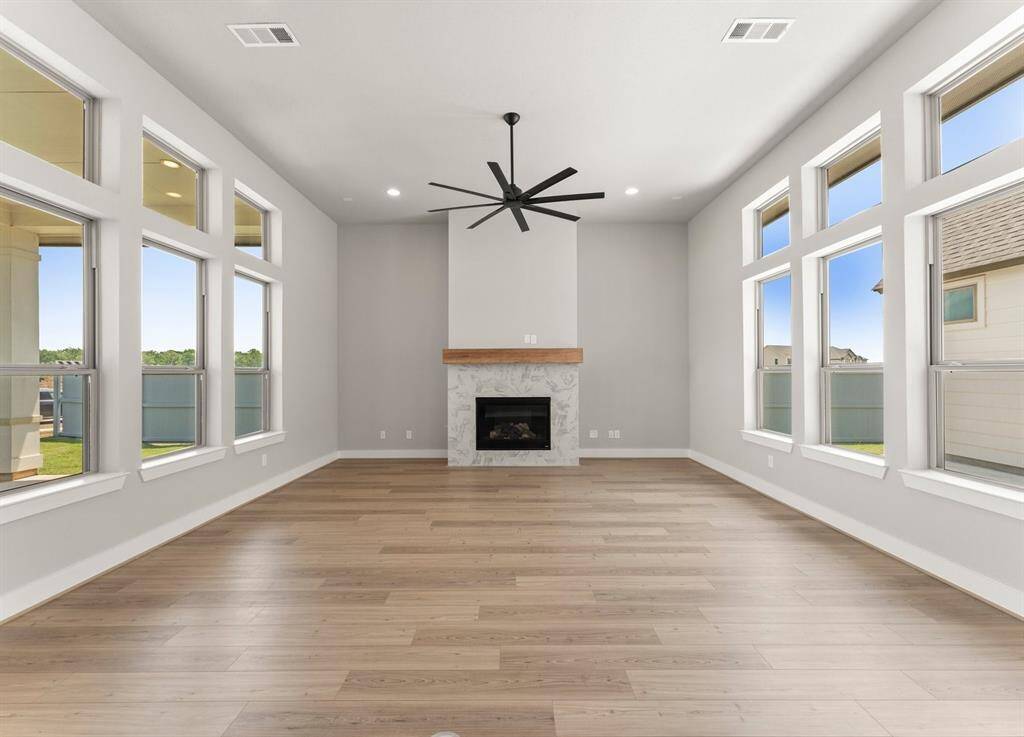 Great Room/Family Room Open to the Kitchen with Lots of Natural Light Overlooking Both Patios