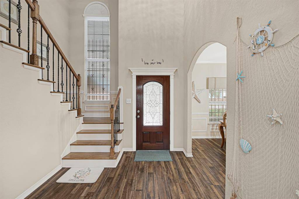 Warm and inviting entryway flows seamlessly into the open living space.