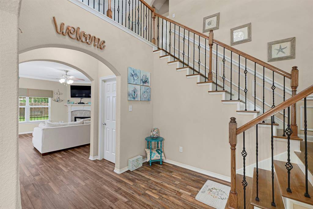 Warm and inviting entryway flows seamlessly into the open living space.
