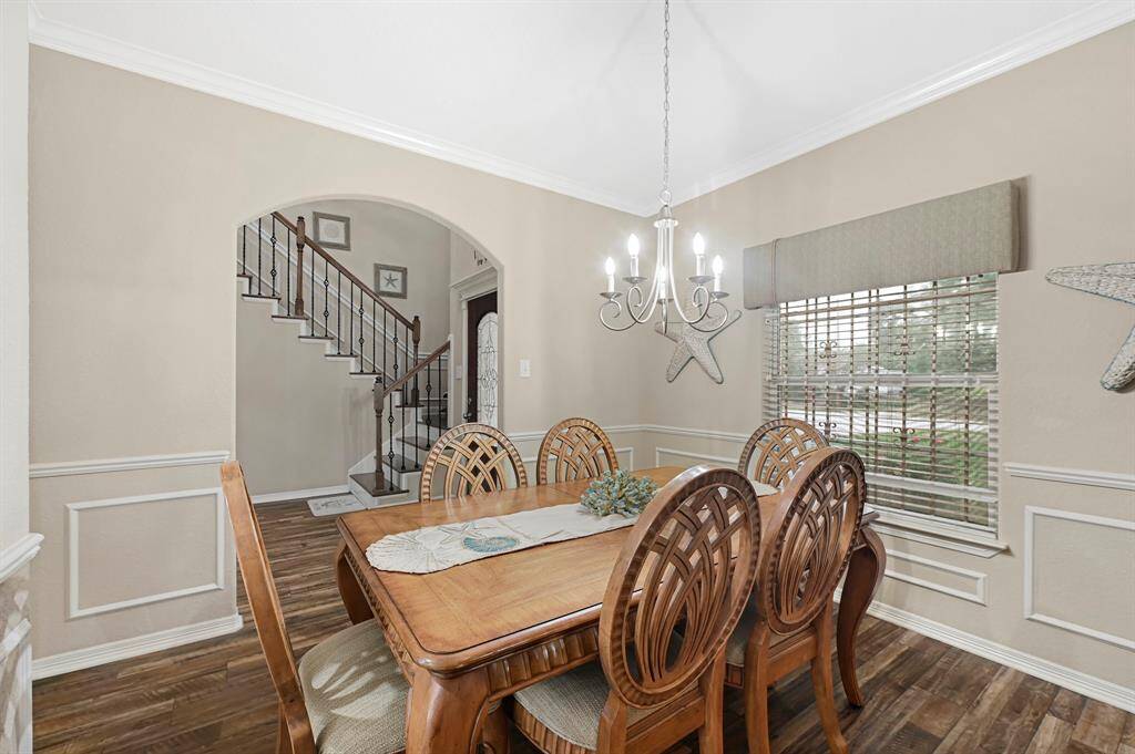 Formal dining area with elegant trim work and natural light, just off the entryway.