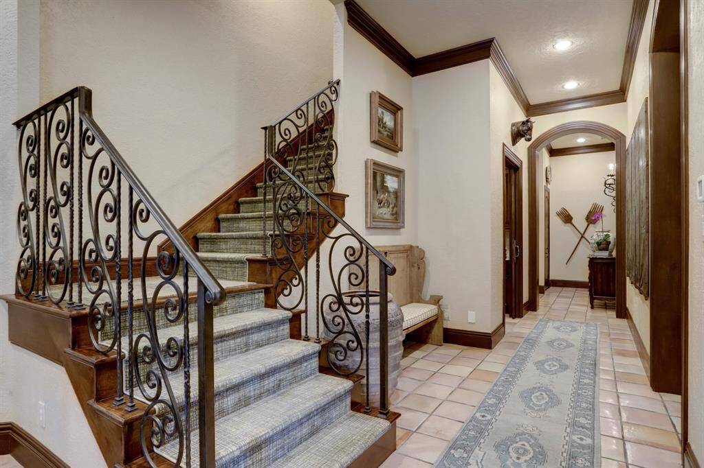 Rear staircase from hall between kitchen and formal areas create perfect livable space for family.