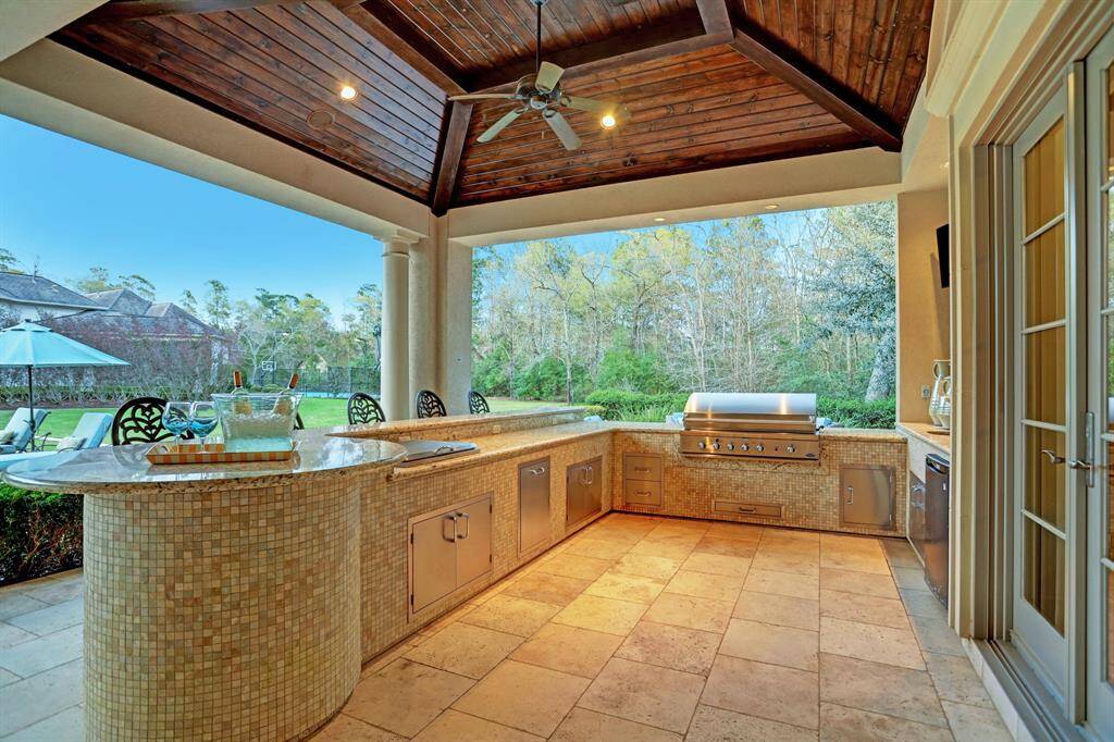 Summer kitchen is fully equipped for all your outdoor dining needs. Extensive covered patio offers a cool, dry location to enjoy all your meals or entertain a plethora of guests.