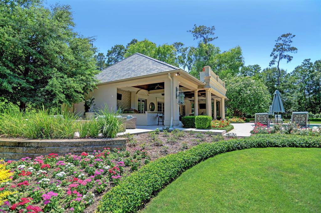 Meticulously maintained and planned gardens wrap the entire estate with pathways to enjoy every type of planting you can dream of allowing for blooms throughout the year.