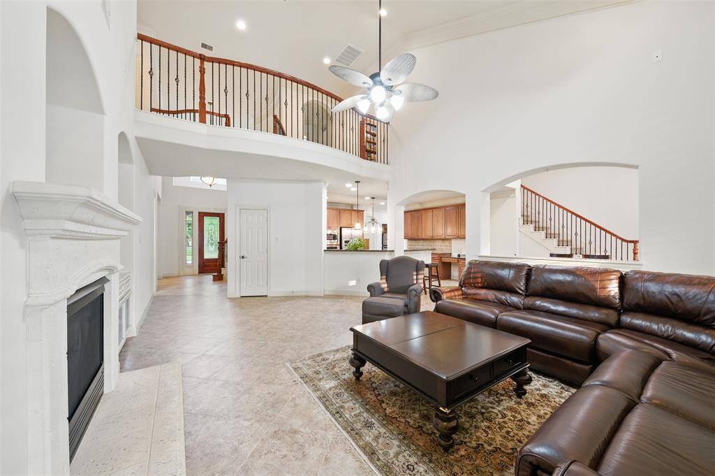 Great view of the home from the opposite side of the living room showing where kitchen and breakfast area are situated.