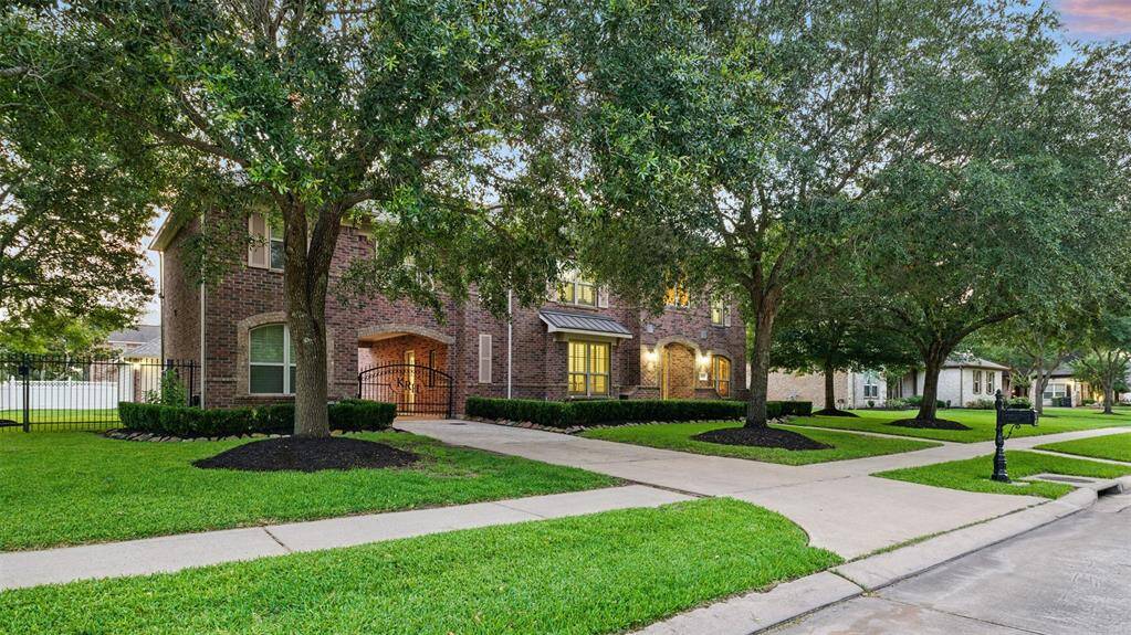 Nestled on an oversized lot with expansive side yards.
