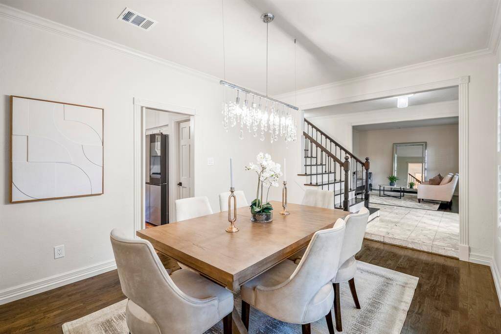 The formal dining room offers thick detailed crown moldings around the door frames.  All the windows in the home have been replaced.