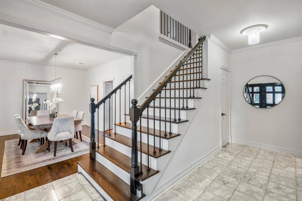The home offers a large foyer, which is perfect when entertaining, beautiful flooring and lighting finish off the space.
