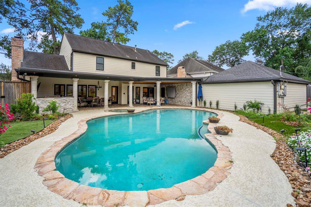Enjoy a backyard oasis surrounded by AMAZINGLY beautiful landscaping, entertain with ease with the convenience of an outdoor kitchen, gas grill, sink & refrigerator.