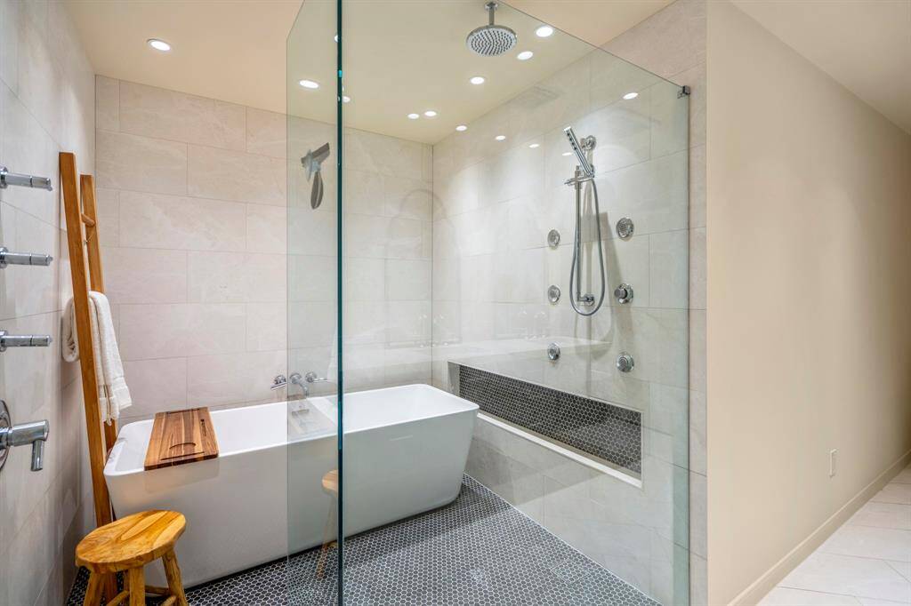 The spa-like shower with soaking stand alone tub that sit on a mosaic tiled flooring are spectacular.