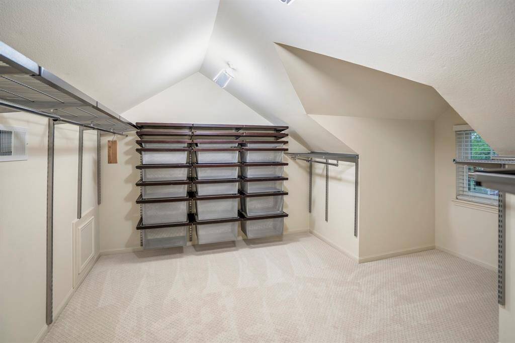 The primary closet offers an organizational as well as a large space for your clothes where you can get to see your items so you can dress for success.