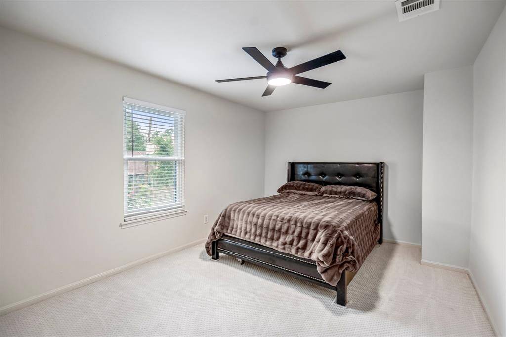 The second bedroom upstairs offer a light and bright room with new ceiling fan, recent carpet and paint and a nice size closet which has new Elfa closet systems.