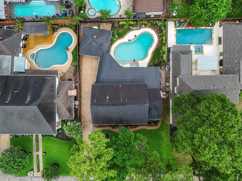 An aerial view of the home which is utilizing the lot for optimal enjoyment.  The home also has a whole-home generator with dedicated gas meter which includes a 10-year transferable warranty (began May 2022).