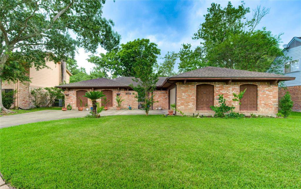Welcome to this wonderful one-story brick home, where mid-century simplicity blends seamlessly with distinctive Southwestern and Mission-style accents found throughout.