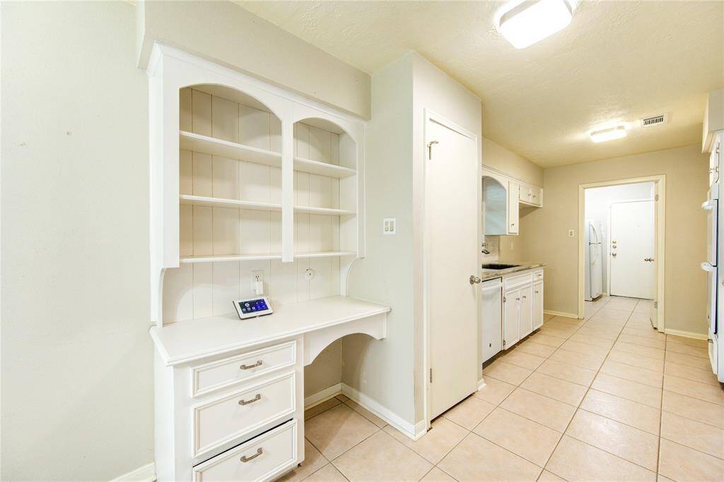 A built-in desk area offers abundant storage and workspace—ideal for party planning, homework, or managing household tasks.