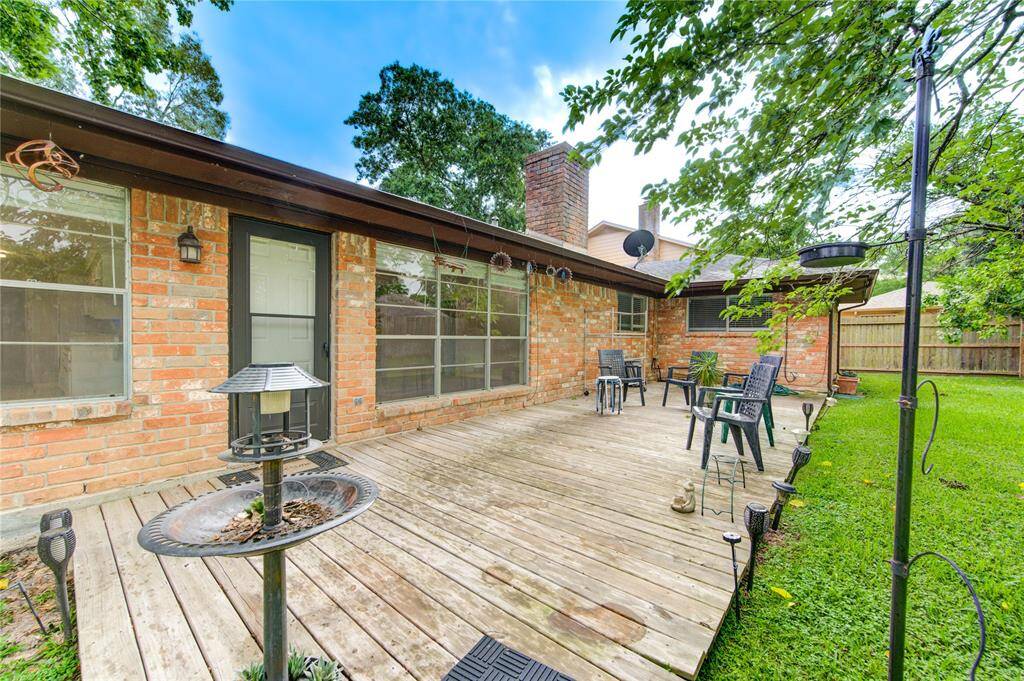 From the wide wood deck, admire the beautifully sized backyard—ideal for gatherings, play, or peaceful evenings.