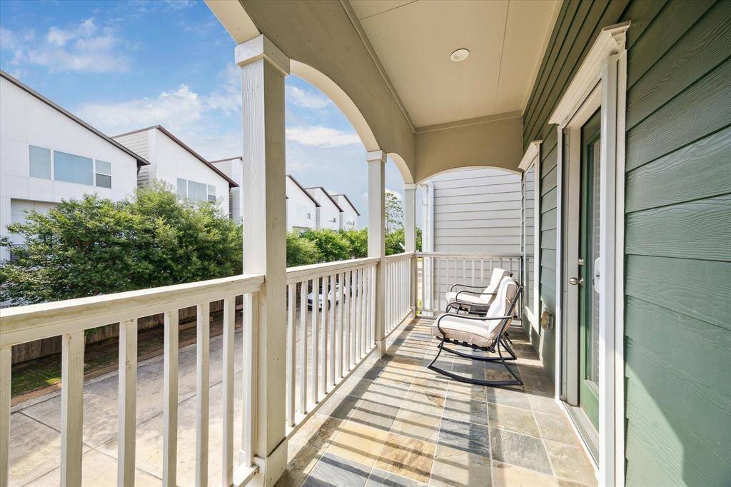 Nice balcony (19x5) outside of primary bedroom, overlooking community drive and green space.
