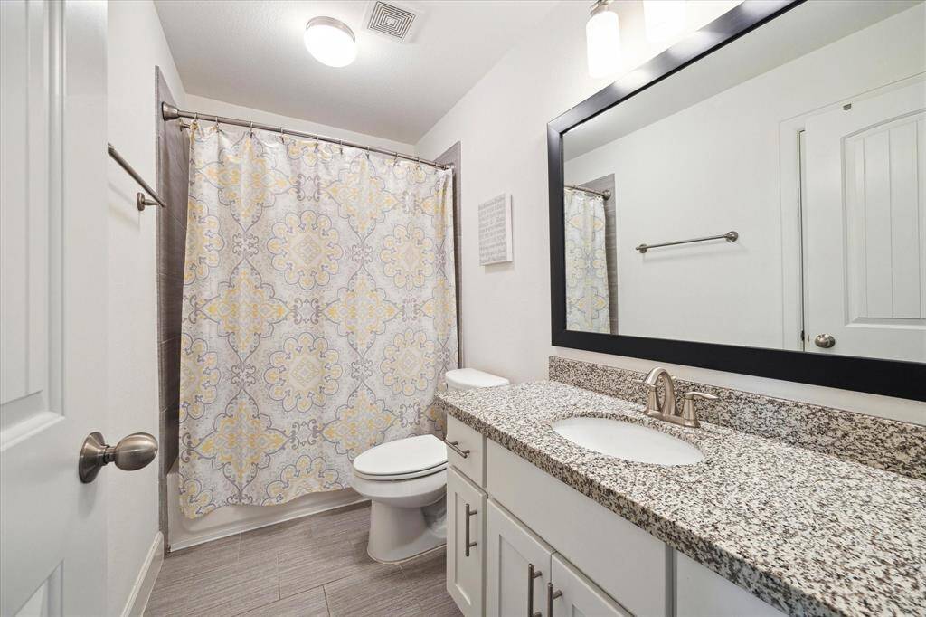 Secondary bath (9x5) features granite counters, storage closet plus more storage under sink.