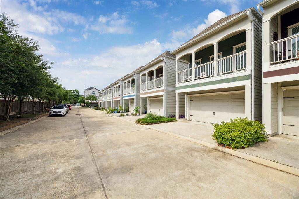 Community view! Very dog (and people) friendly. There is great greenspace on the left side looking ahead towards the gate. Abundant inside the gate parking.