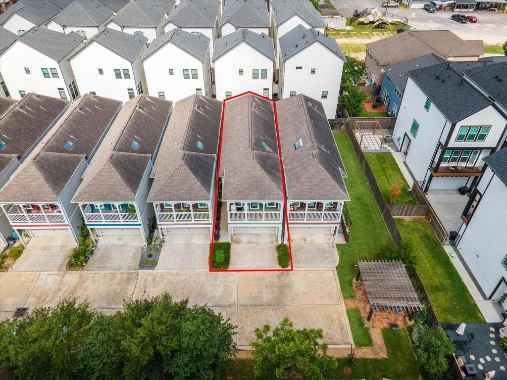 Aerial of 5 of the 8 homes (with red outlining the subject property) with picnic area to the right.