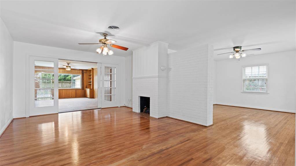 Step into a light-filled living room with an inviting fireplace.