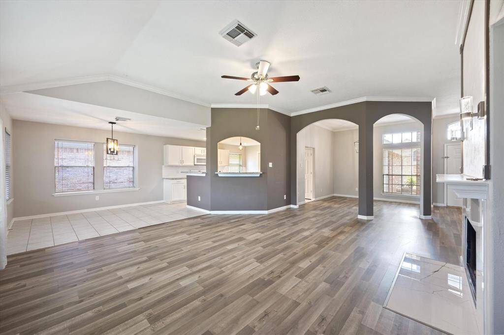 Living room is spacious and includes a fireplace