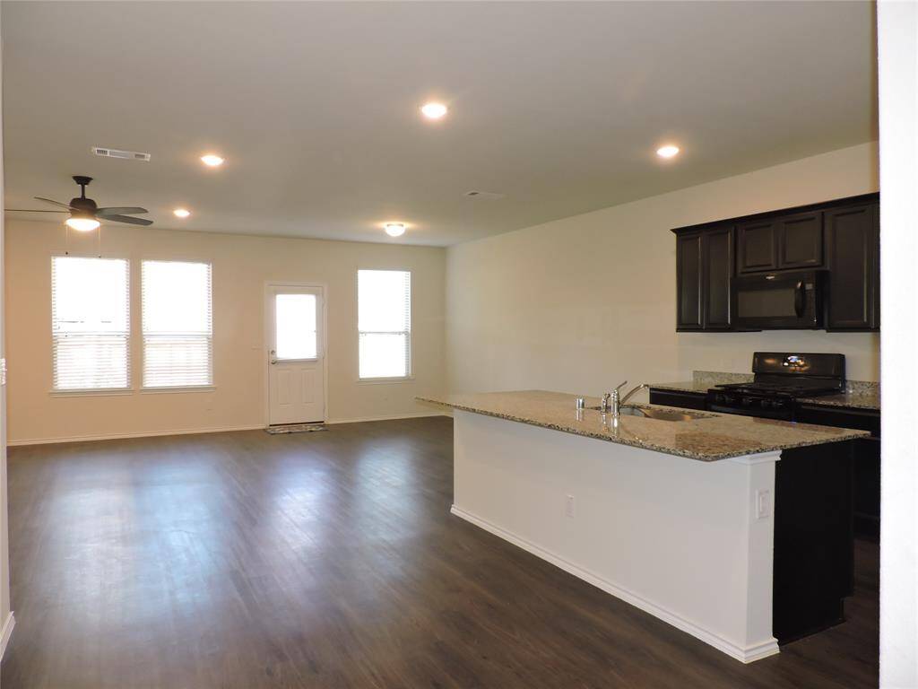 Very open living area, dining and kitchen with access to backyard.