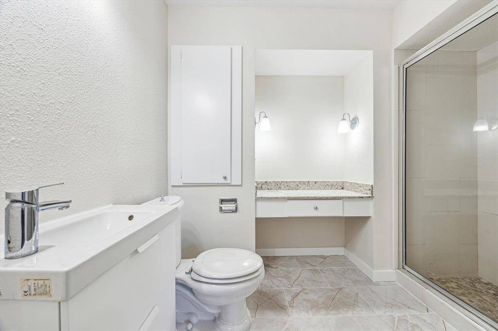 Primary bathroom with long shower.