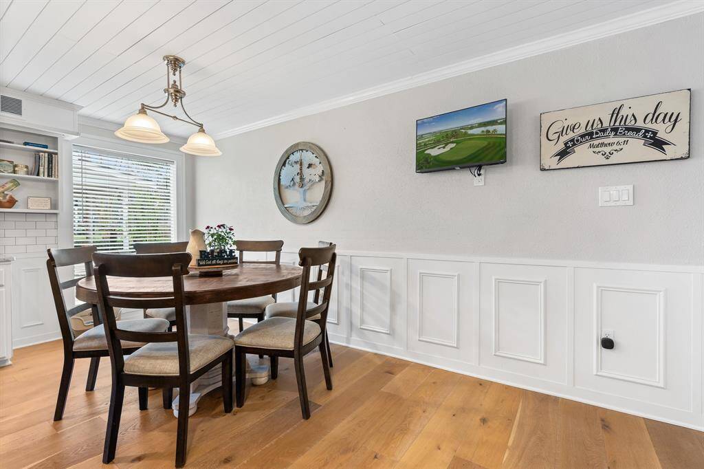 Elegant wainscoting, and warm luxury flooring.