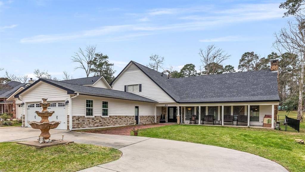 Spacious circular and double driveways offer abundant parking options.
