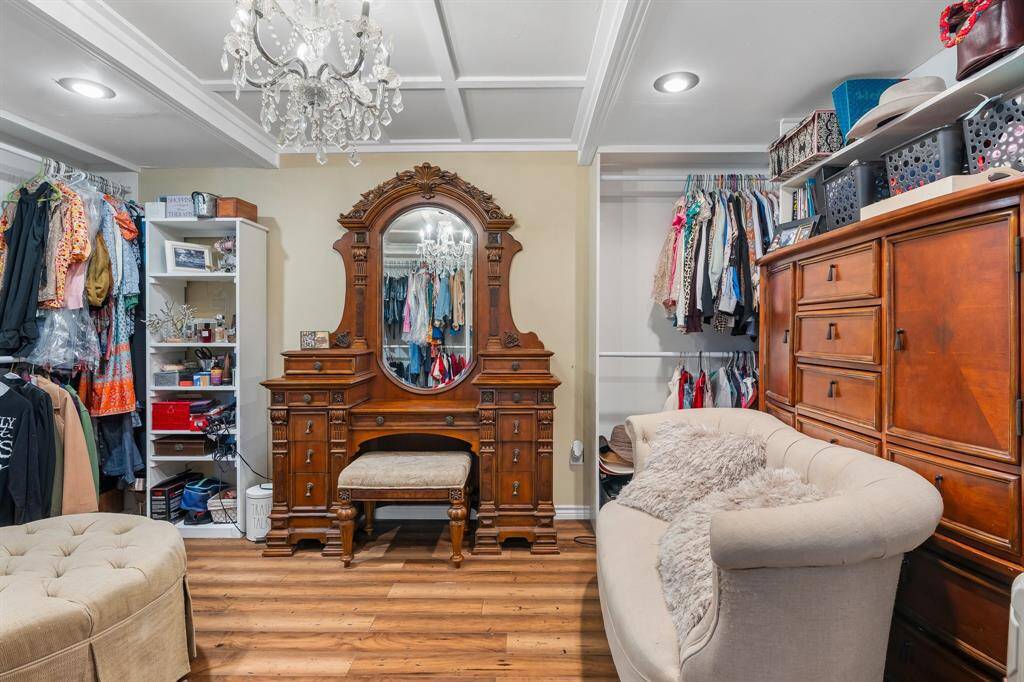 Luxurious and spacious walk-in closet with elegant storage solutions.