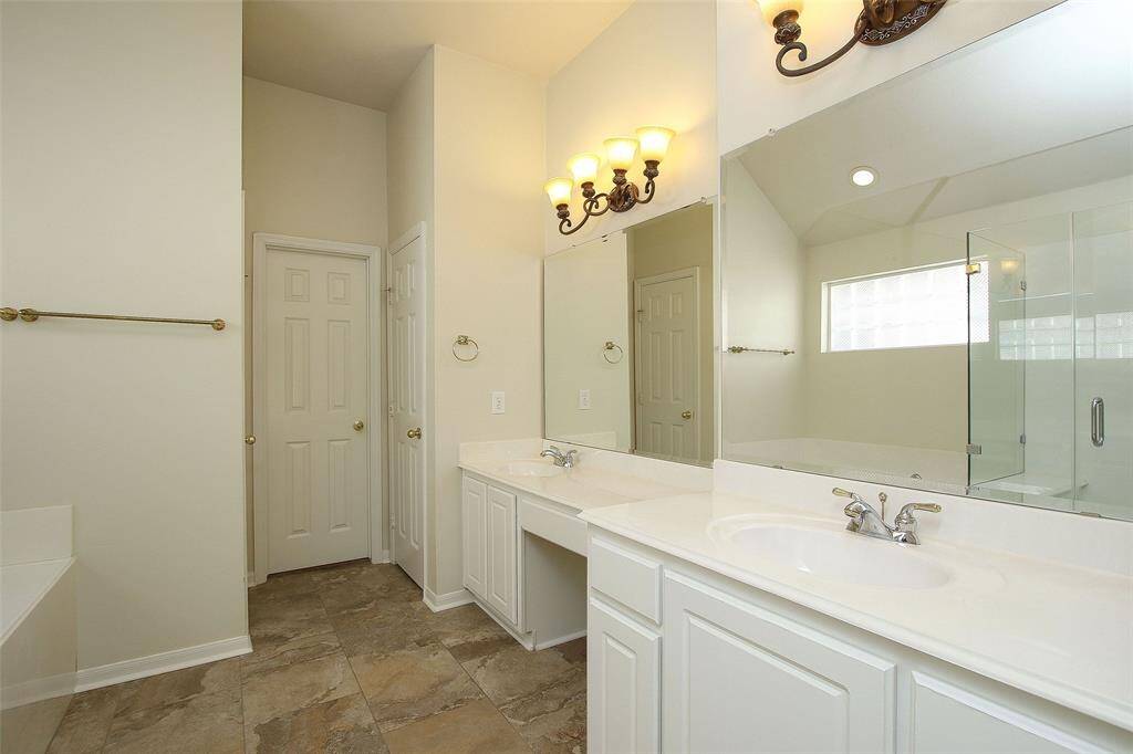 Primary Full Bath with Double Sinks, Garden Tub and Separate Shower.