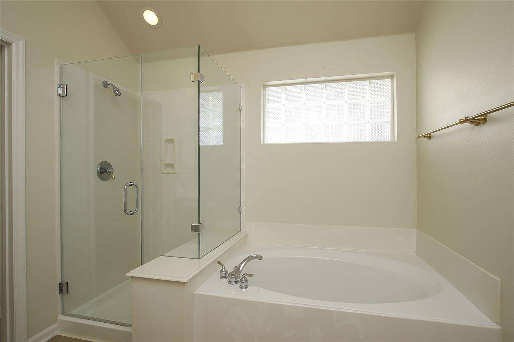 Primary Garden Tub and Separate Shower.