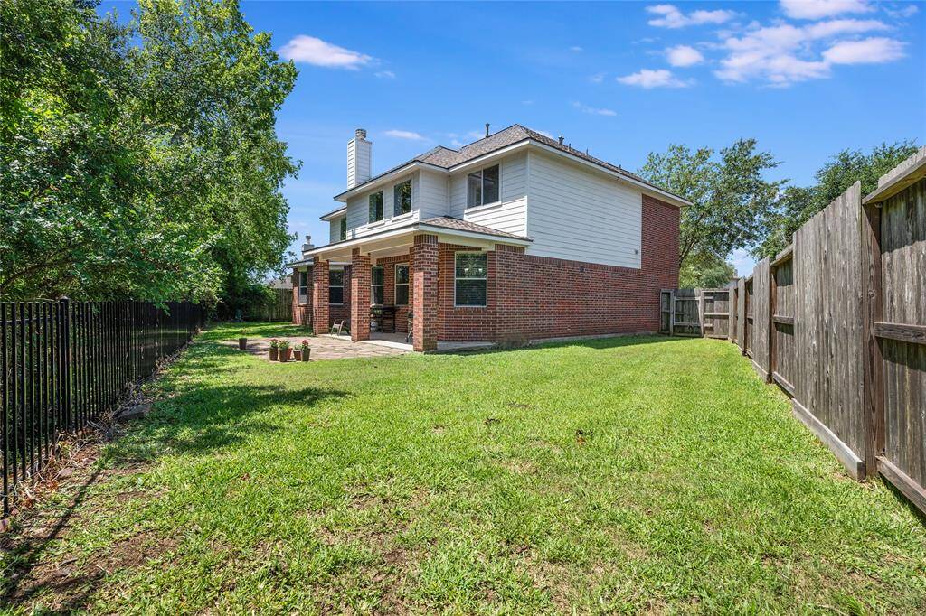 Beautiful mostly brick home, with hardy plank siding and a lovely covered patio.
