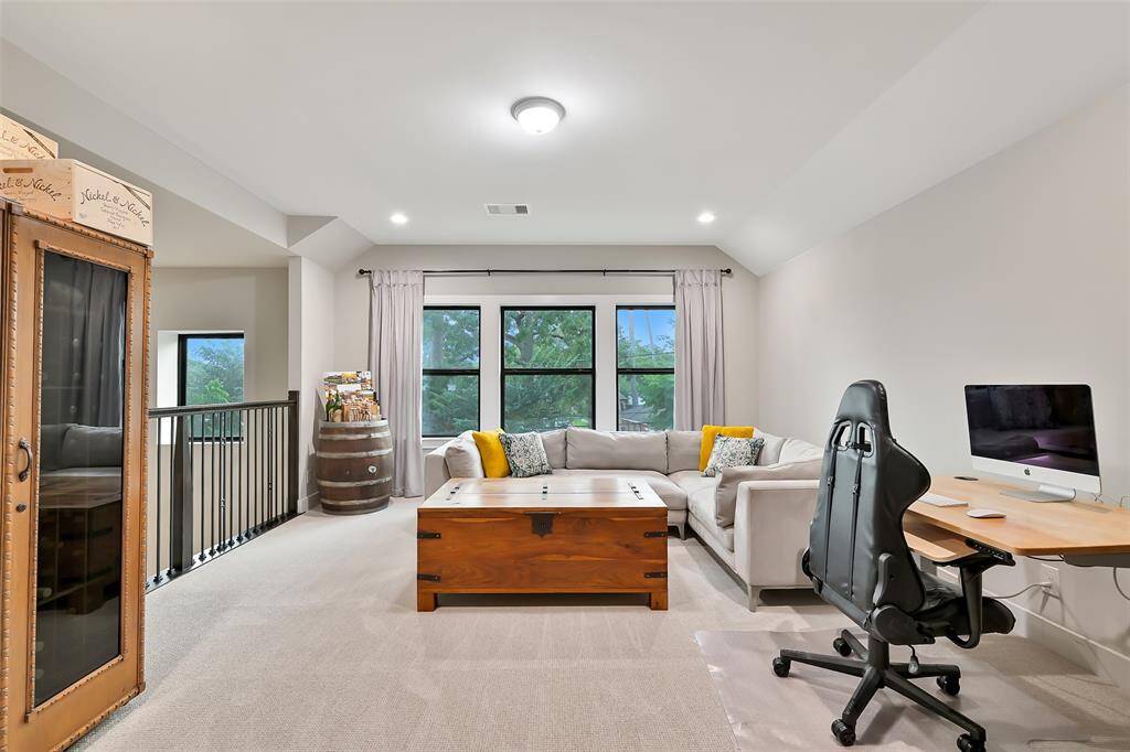 Gameroom on second floor is huge and overlooks living room.