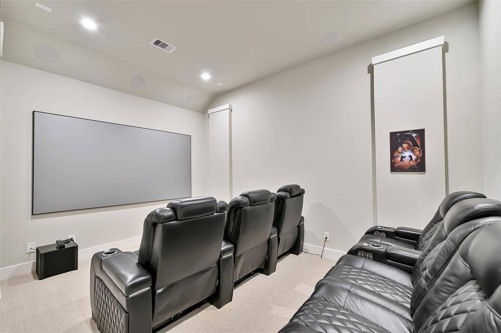 Enjoy watching movies in the media room located off the game room features surround sound, theatre like screen and lazy boy seating.