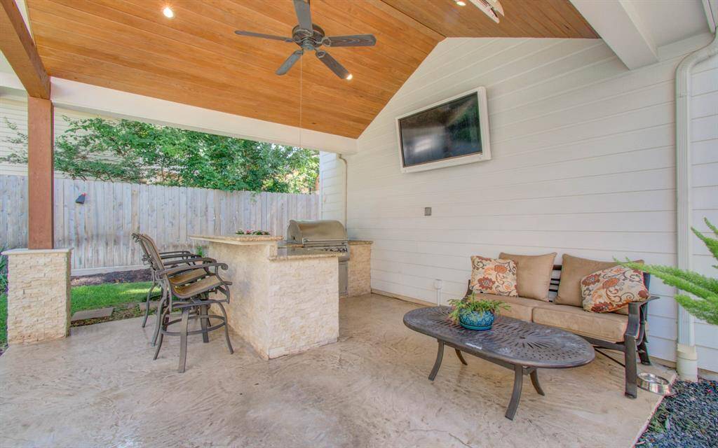 Phenomenal outdoor kitchen area! This is a great place to entertain and watch the game while having a pool party.  Plenty of room for bbq equipment in addition to the built in grill