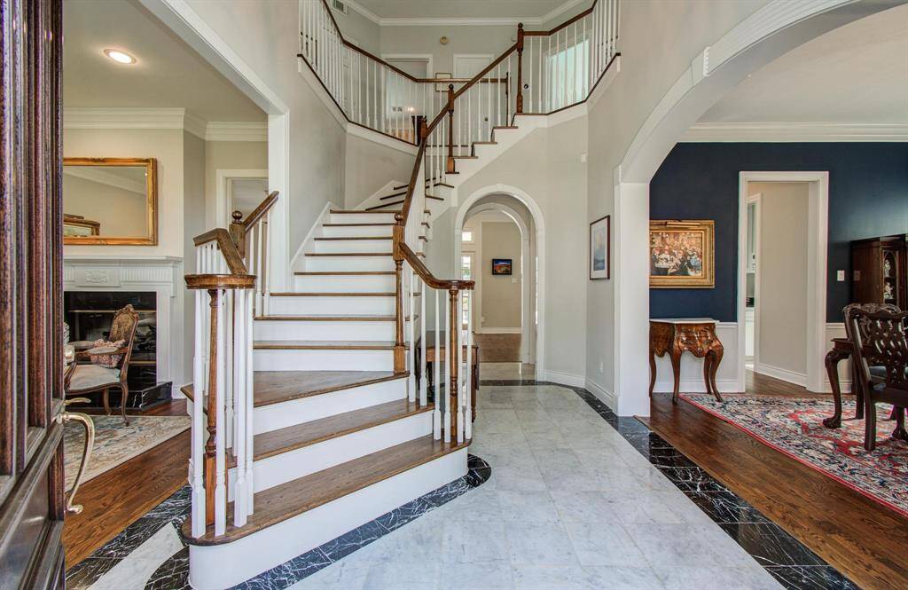 An elegant and traditional entry way greet you as you enter the home through a mahogony front door.  The formal living and formal dining are on either side.  There is a great under-stair closet with plenty of storage