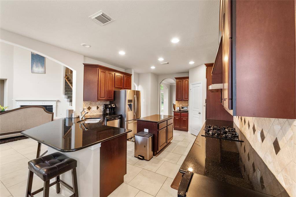 Granite Kitchen counter extends to bar seating