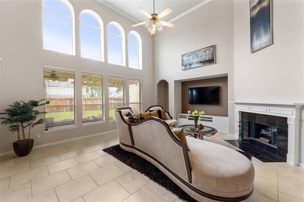 Living room extends tile floor and Italian sofa