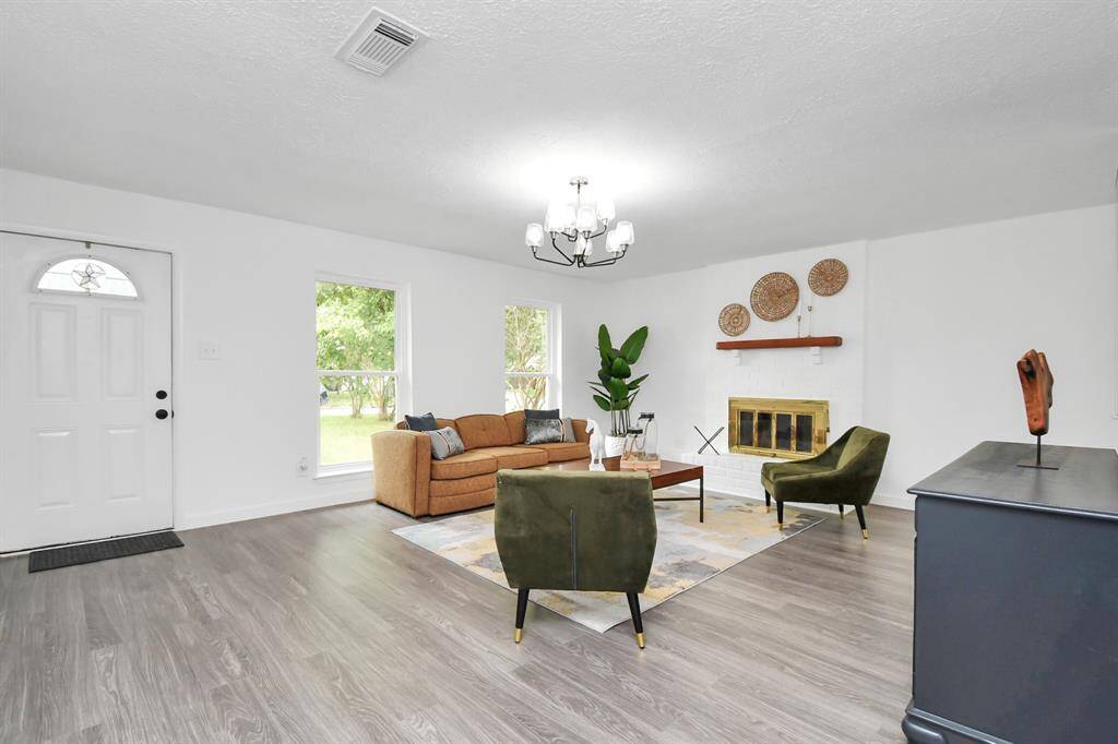 Great size living room! With tons of natural lighting throughout!