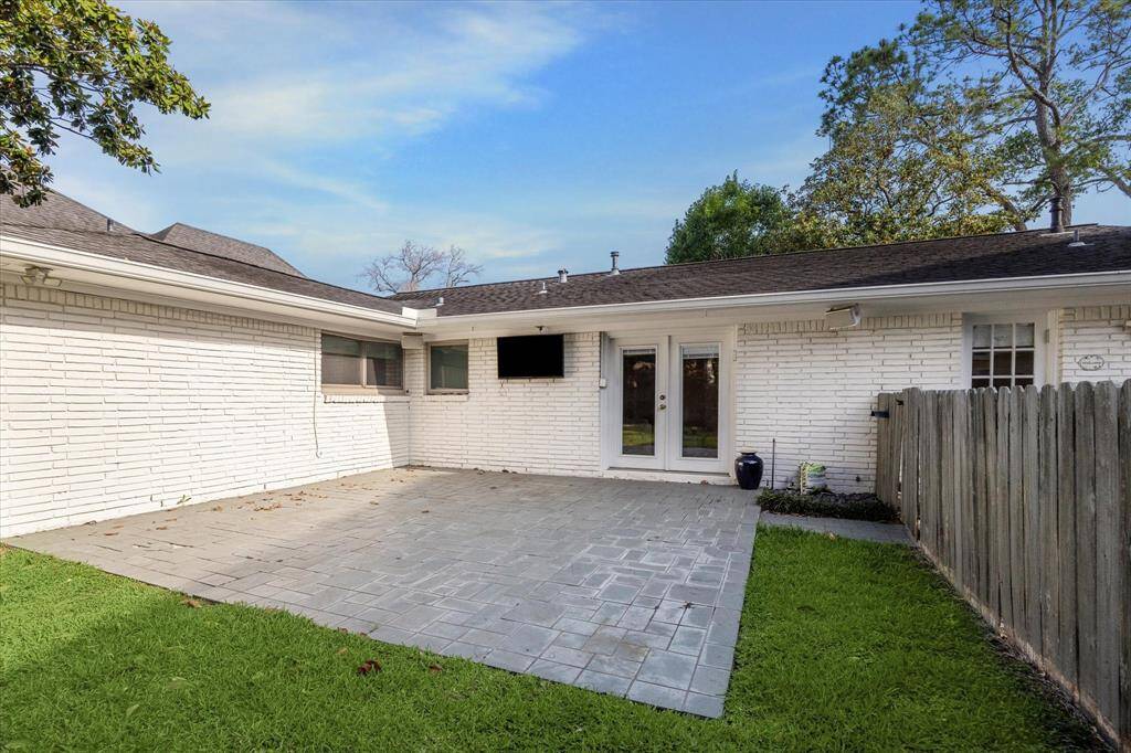 Back patio with double doors leading to the living room.