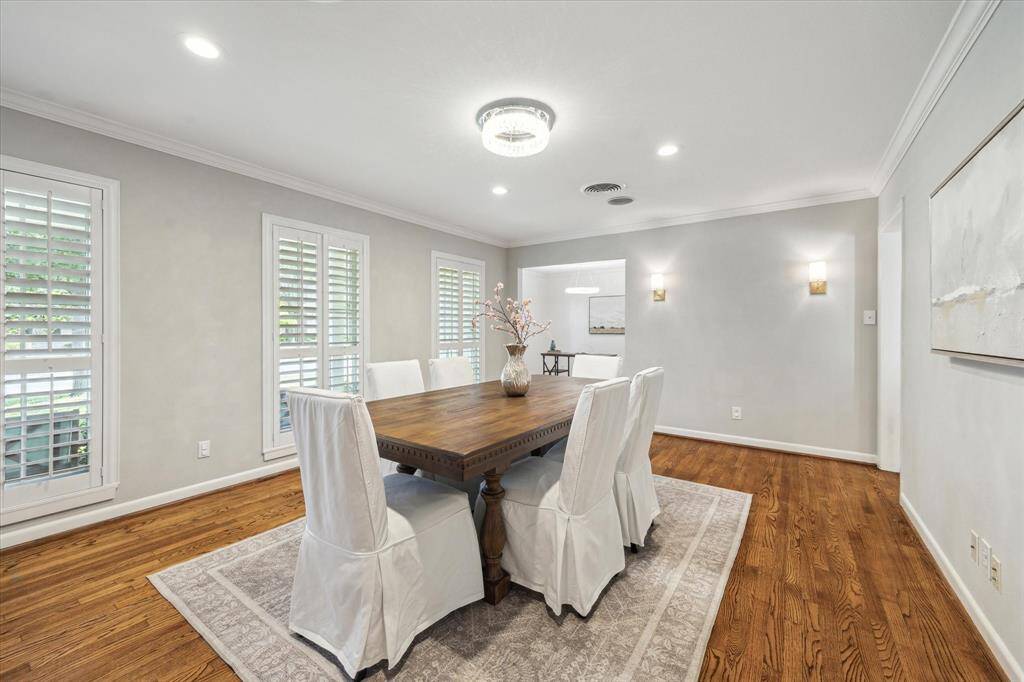 Formal dining room in the front of the home with plantation shutters throughout and double pane Renewal by Anderson windows. This room could also be used as a formal sitting room.