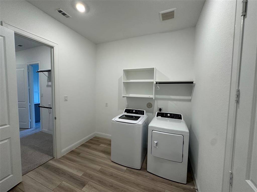 Laundry with access to master closet