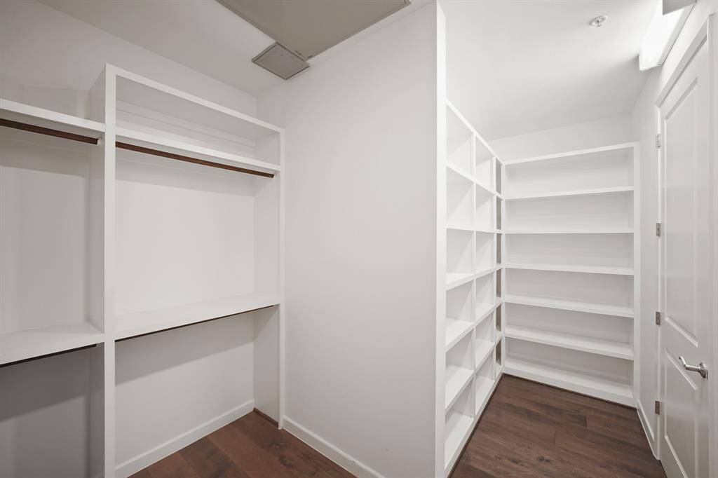 Huge primary closet with lots of storage