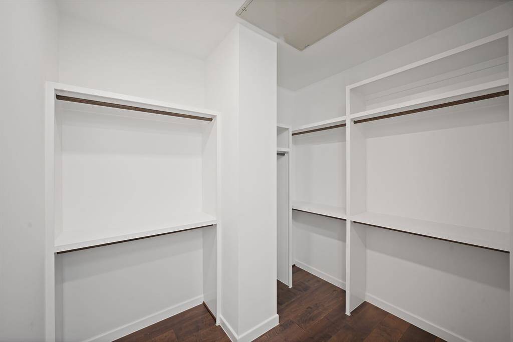 Huge primary closet with lots of storage