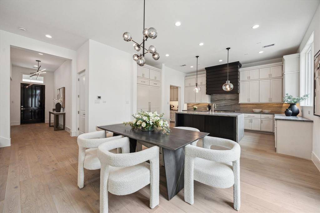 Welcome to 5 Wentworth Green Way! Step into luxury with the spacious Arundel floorplan, offering 4-5 bedrooms, 4.5 bathrooms, and approximately 4,243 square feet of living space. This residence is conveniently situated near the community dog park, combining luxury living with easy access to outdoor amenities.